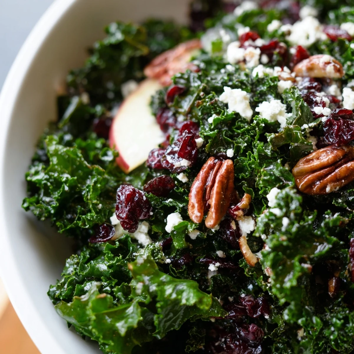 Vibrant Winter Kale Salad with Dried Cranberries tossed with fresh greens and a tangy citrus dressing, ready for a healthy weekday lunch.