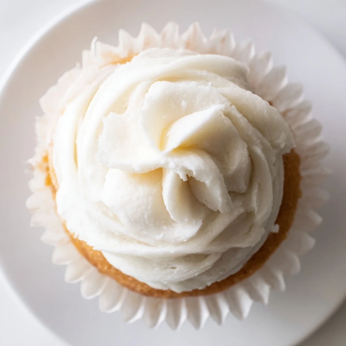 Light and fluffy homemade vanilla cupcakes with swirls of creamy vanilla buttercream frosting for dessert