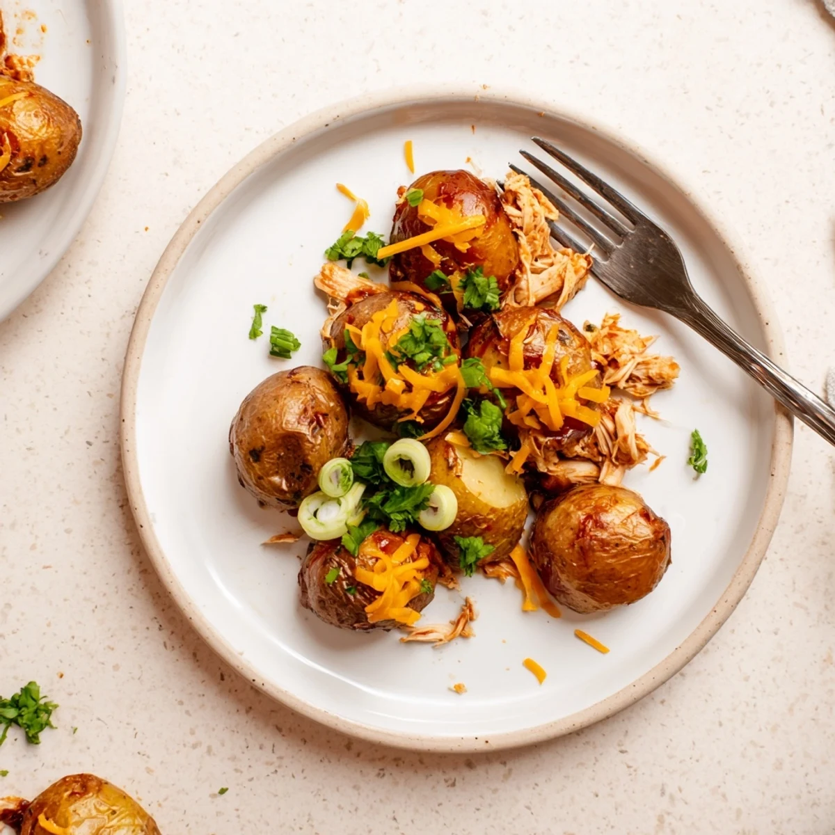 A hearty skillet of honey BBQ chicken potatoes drizzled with sweet smoky sauce