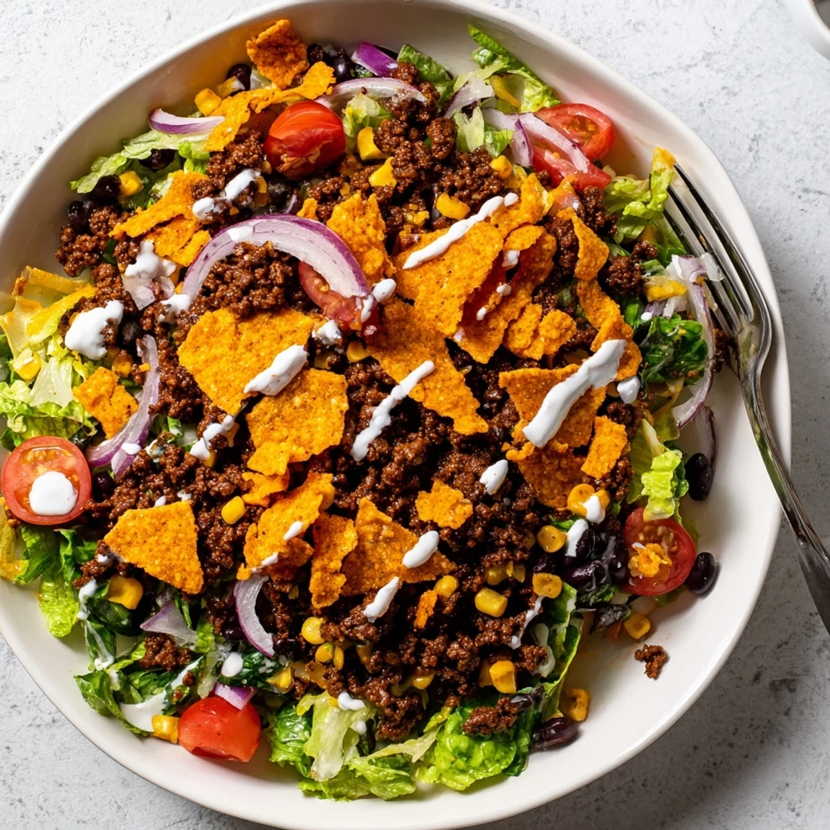 Family-style Simple Doritos Taco Salad served immediately to keep chips delightfully crunchy
