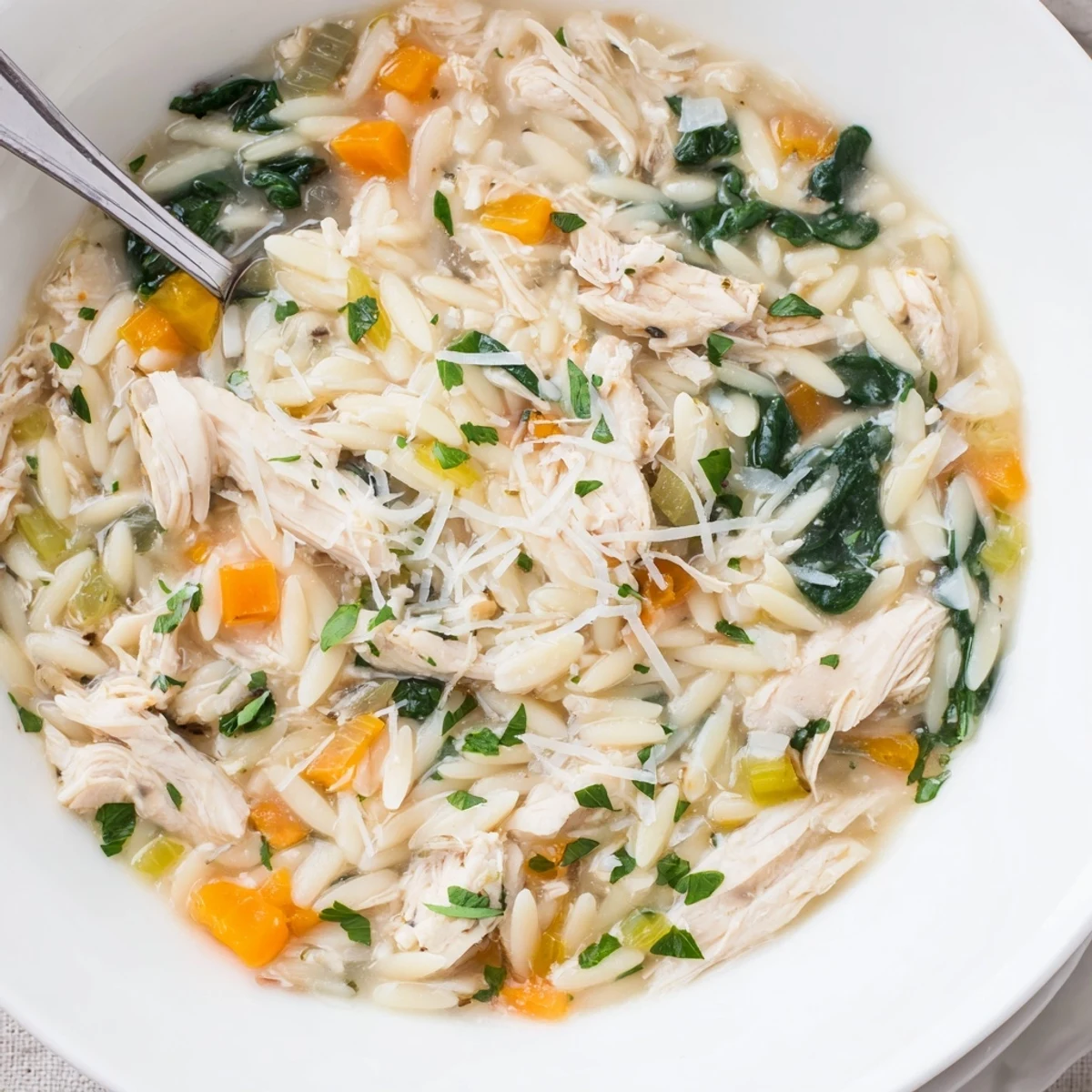 Creamy Chicken Florentine Soup With Orzo, silky broth, orzo pearls, Parmesan garnish