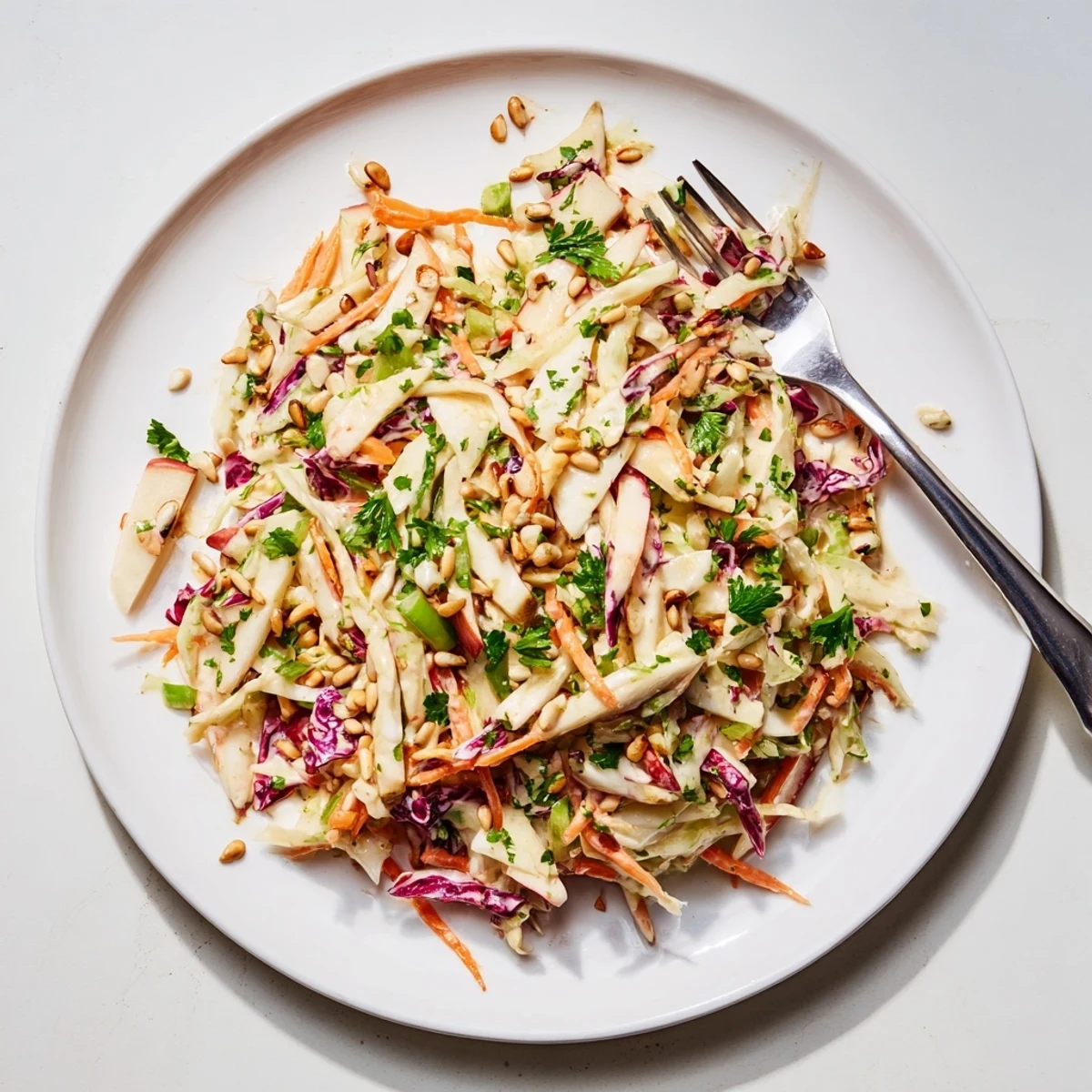 Fresh apple coleslaw with crunchy green and red cabbage in a creamy tangy dressing